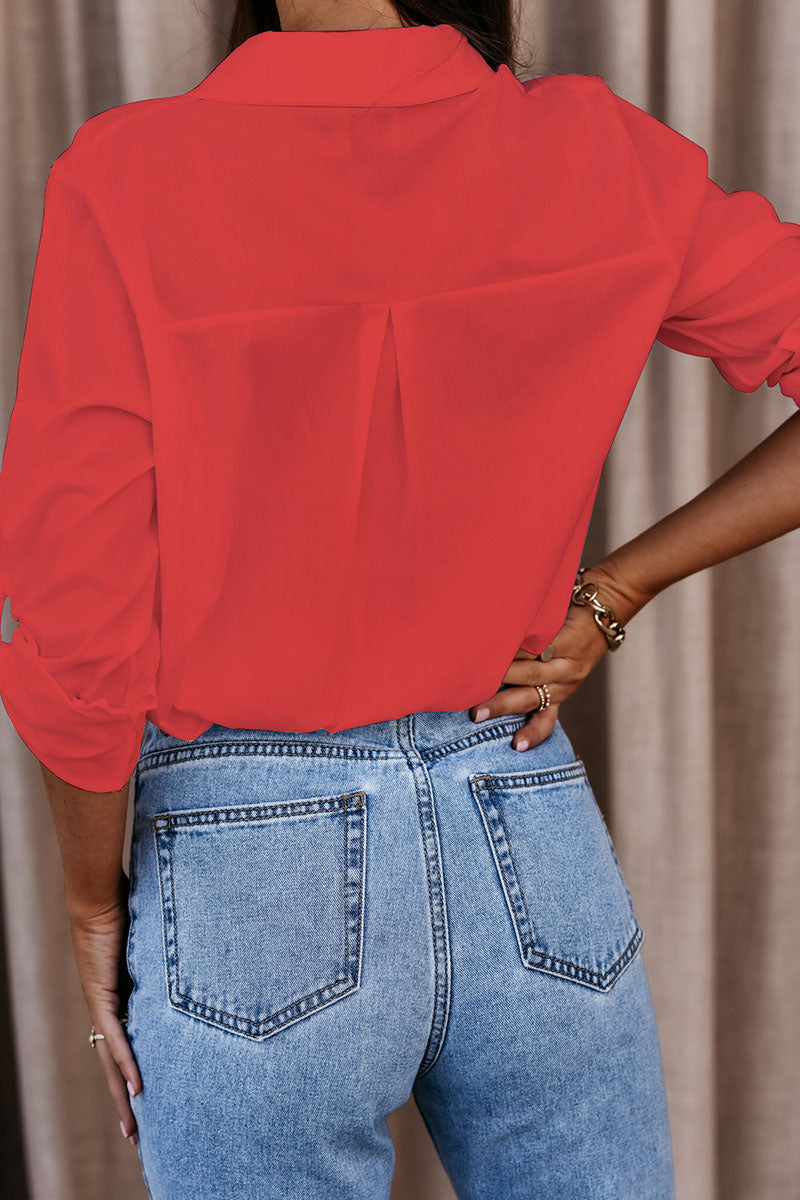 Red oversized button-up long sleeve shirt, back view with center pleat