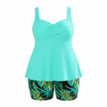 Plus size turquoise ribbed tankini set with V-neck crisscross and leaf-print shorts