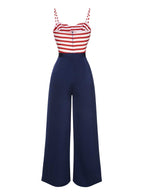 Dark blue wide-leg jumpsuit with red-and-white striped corset bodice and bow front