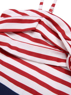 Close-up of red-and-white striped sweetheart bust fabric on a spaghetti-strap jumpsuit