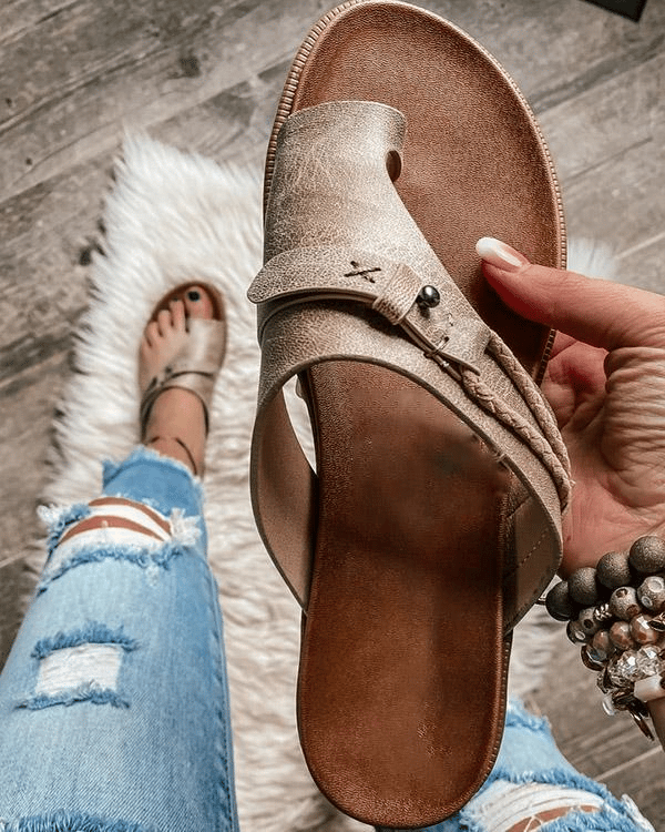 Brown open-toe comfort sandals with buckle ankle strap and cushioned footbed