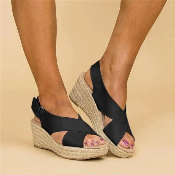 Orthopedic espadrille wedge sandals in black, open-toe crisscross straps on textured wedge