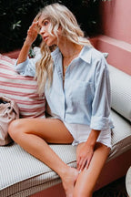 Sky blue casual everyday button-front blouse with collar and sleeves rolled up