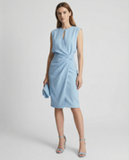 Light blue sleeveless dress with keyhole neckline and gathered drape at the waist