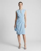 Light blue sleeveless knee-length dress with keyhole neckline and wrapped waist drape