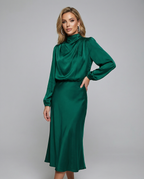 Deep green long-sleeve satin midi dress with high neck and slim, draped skirt
