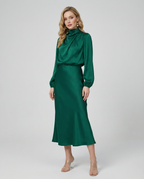 Emerald green long-sleeve satin midi dress with high neck and fitted skirt