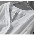 White linen blouse V-neck and placket with small front buttons