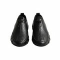 Black leather casual sneaker with lace-up and stitched toe panel.