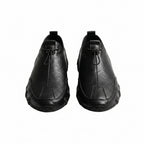 Black leather casual sneaker with lace-up and stitched toe panel.