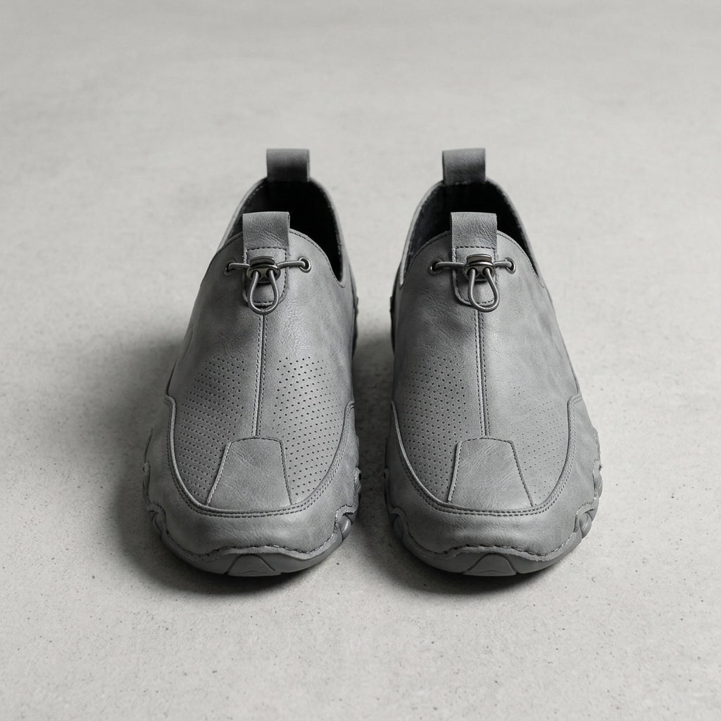 Gray leather casual sneaker with lace-up, perforated detailing, and padded collar.