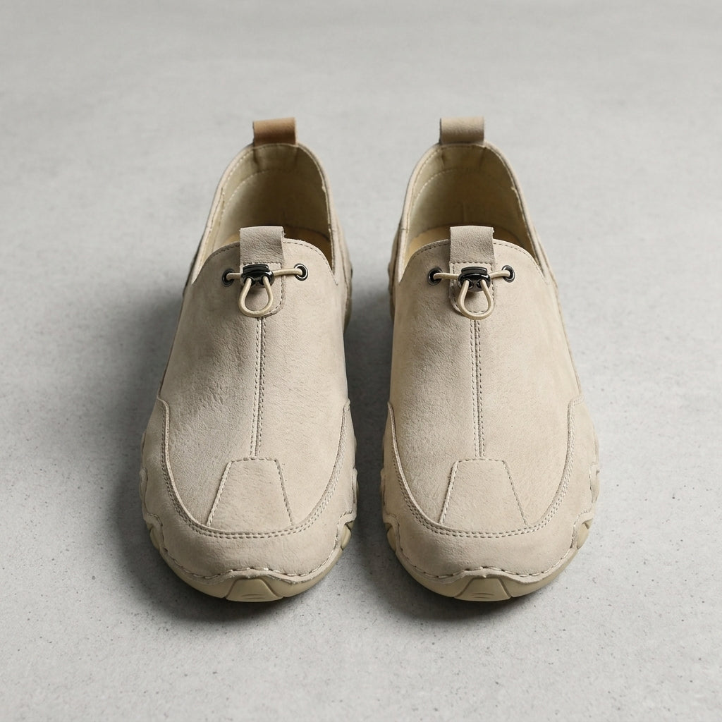 Beige leather casual sneaker with lace-up and stitched side panels.