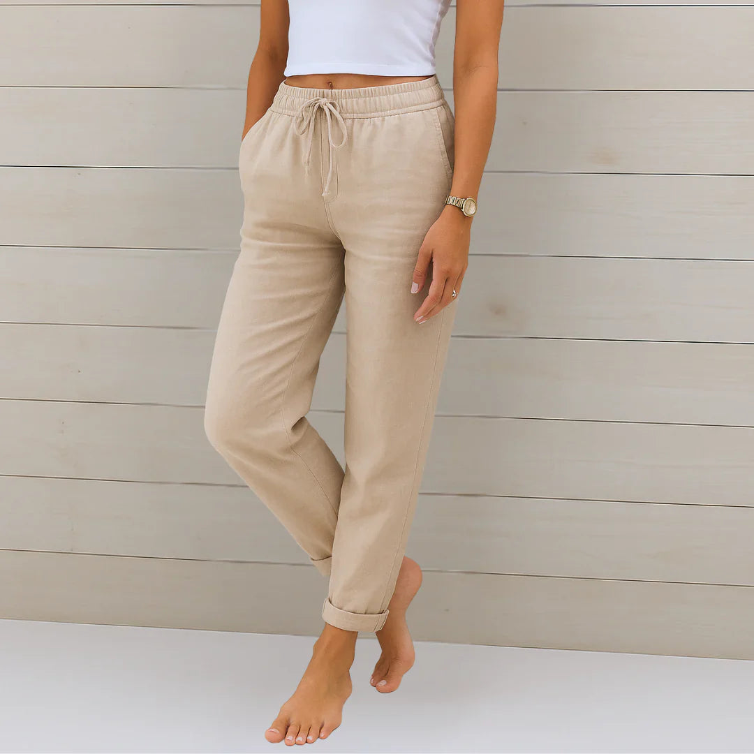 Cream linen stretch trousers with elastic drawstring waist and cuffed ankle hems