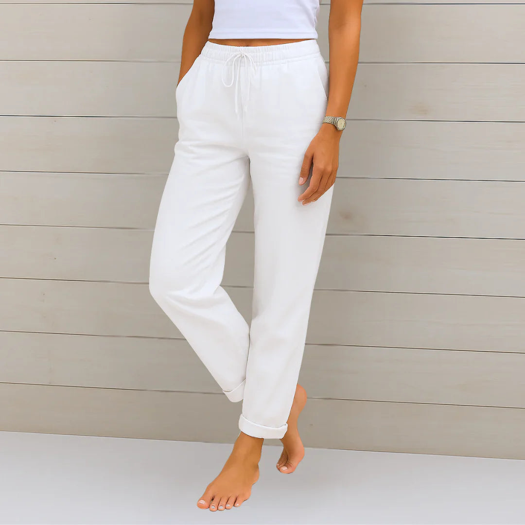White linen stretch trousers with elastic drawstring waist and cuffed ankle cuffs