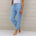 Light blue linen stretch trousers with elastic drawstring waist and cuffed ankles