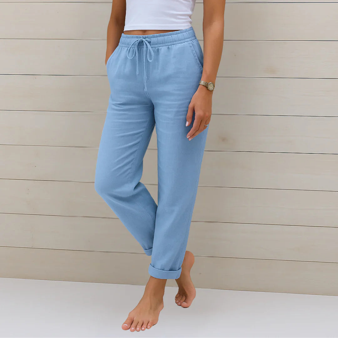 Light blue linen stretch trousers with elastic drawstring waist and cuffed ankles