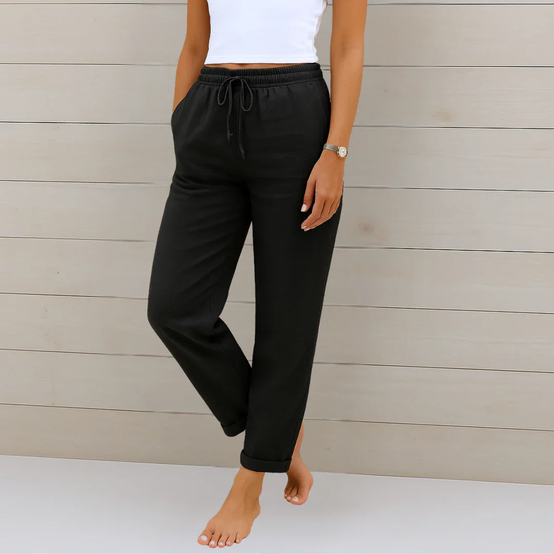 Black linen stretch trousers with elastic drawstring waist and cuffed ankle hems