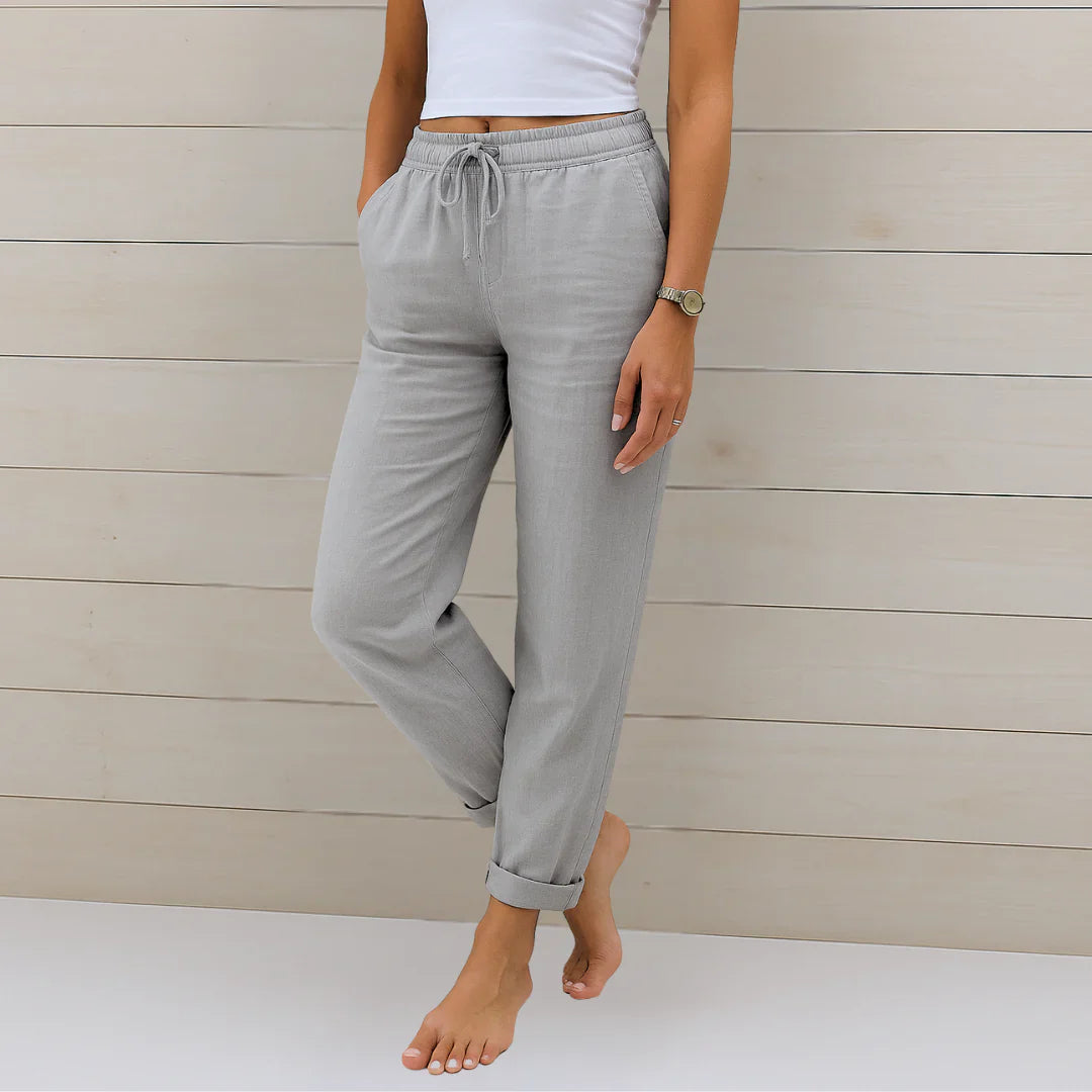 Light gray linen stretch trousers with elastic drawstring waist and cuffed ankle cuffs