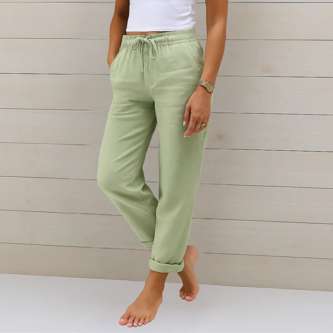 Sage green linen stretch trousers with elastic drawstring waist and cuffed ankle cuffs