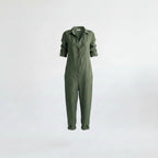 Green linen jumpsuit with button front, V-neck collar, long sleeves, and tapered legs