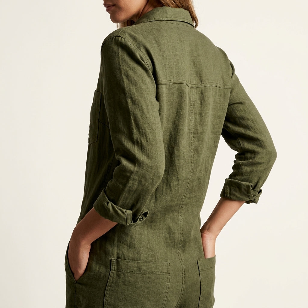 Olive green linen jumpsuit with button back and back yoke, long sleeves, and patch pocket