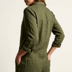 Olive green linen jumpsuit with button back and back yoke, long sleeves, and patch pocket
