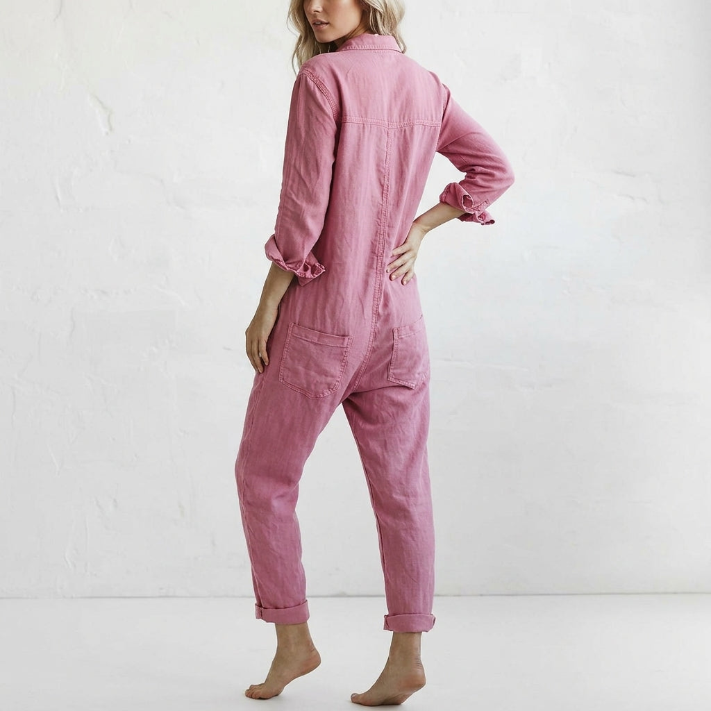 Pink linen jumpsuit back view with long sleeves, button closure, and patch pockets