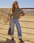 Olive green oversized knit pullover sweater with crew neck and elbow-length sleeves