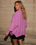 Oversized knit pullover sweater in lilac-purple, back/side view with ribbed trim
