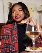 Plaid blazer with padded shoulders in red multi, open front, long sleeves with visible cuff details.