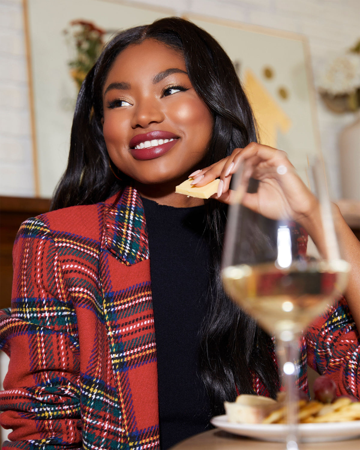 Plaid blazer with padded shoulders in red multi, open front, long sleeves with visible cuff details.