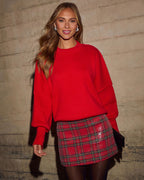 Red knit oversized pullover with crew neckline and ribbed hem cuffs