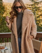Cream teddy coat detail: plush teddy fabric, side pockets, open lapels