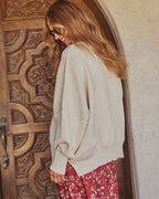 Ivory oversized knit pullover sweater from back with dropped shoulders