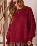 Oversized knit pullover sweater in deep red with textured knit and ribbed neckline