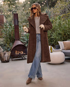 Brown teddy coat with open front, two side pockets, long sleeves, relaxed fit