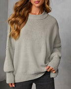 Heather gray knit oversized pullover sweater, crew neck, ribbed hem and cuffs.