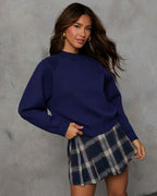 Navy knit crewneck sweater with long sleeves; front view with ribbed collar and cuffs.