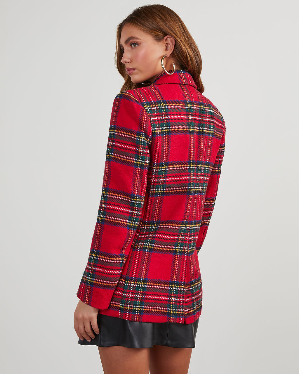 Back view of a red multi plaid blazer with padded shoulders and long sleeves.