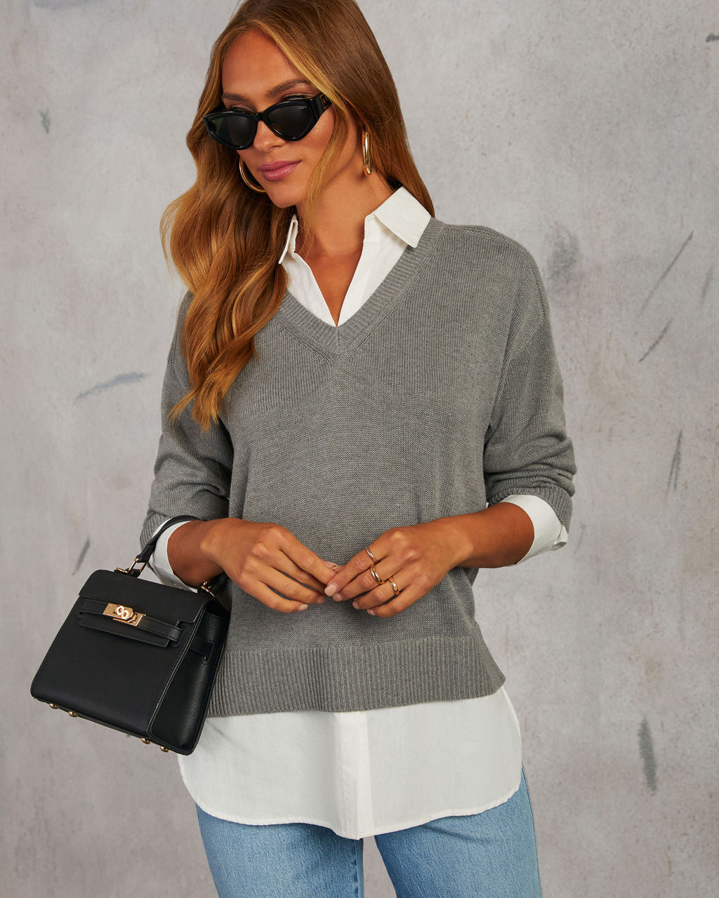 Grey V-neck pullover sweater with white poplin shirt placket and hem