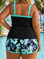 Plus size tankini set back view, black top with teal straps and blue floral shorts
