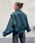 Teal oversized zip bomber jacket with side pockets and ribbed waistband