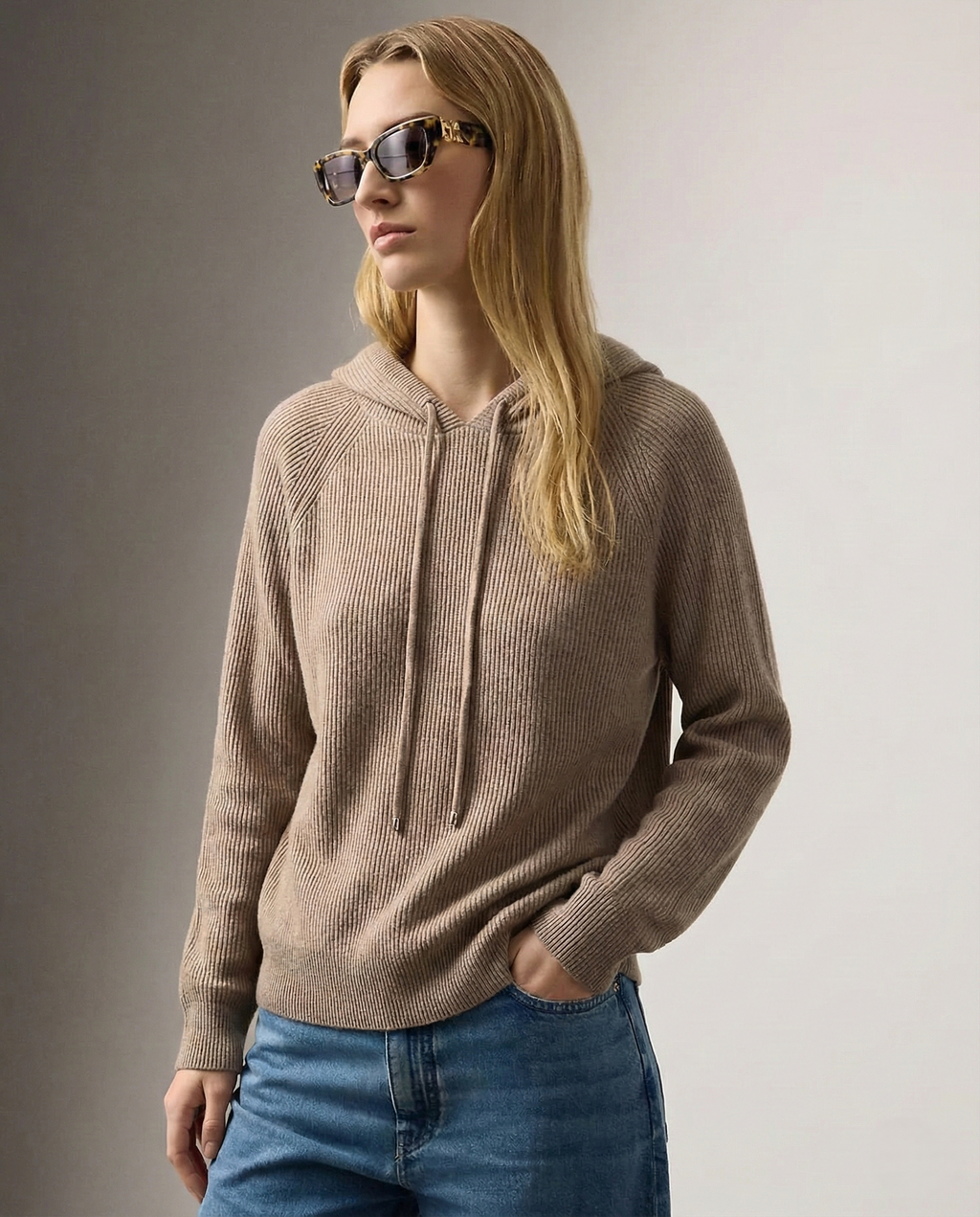 Women's knit hoodie in taupe-brown with drawstring hood, side view