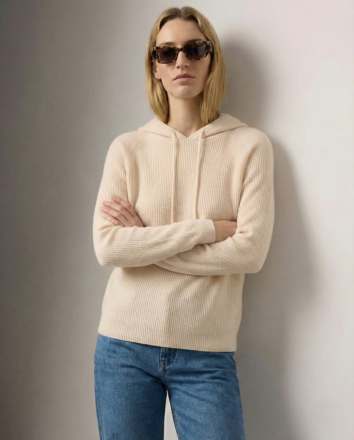 Women's knit hoodie in light beige with drawstring hood and front pocket