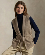 Camel merino wool belted sweater vest, sleeveless V-neck with tie waist detail.
