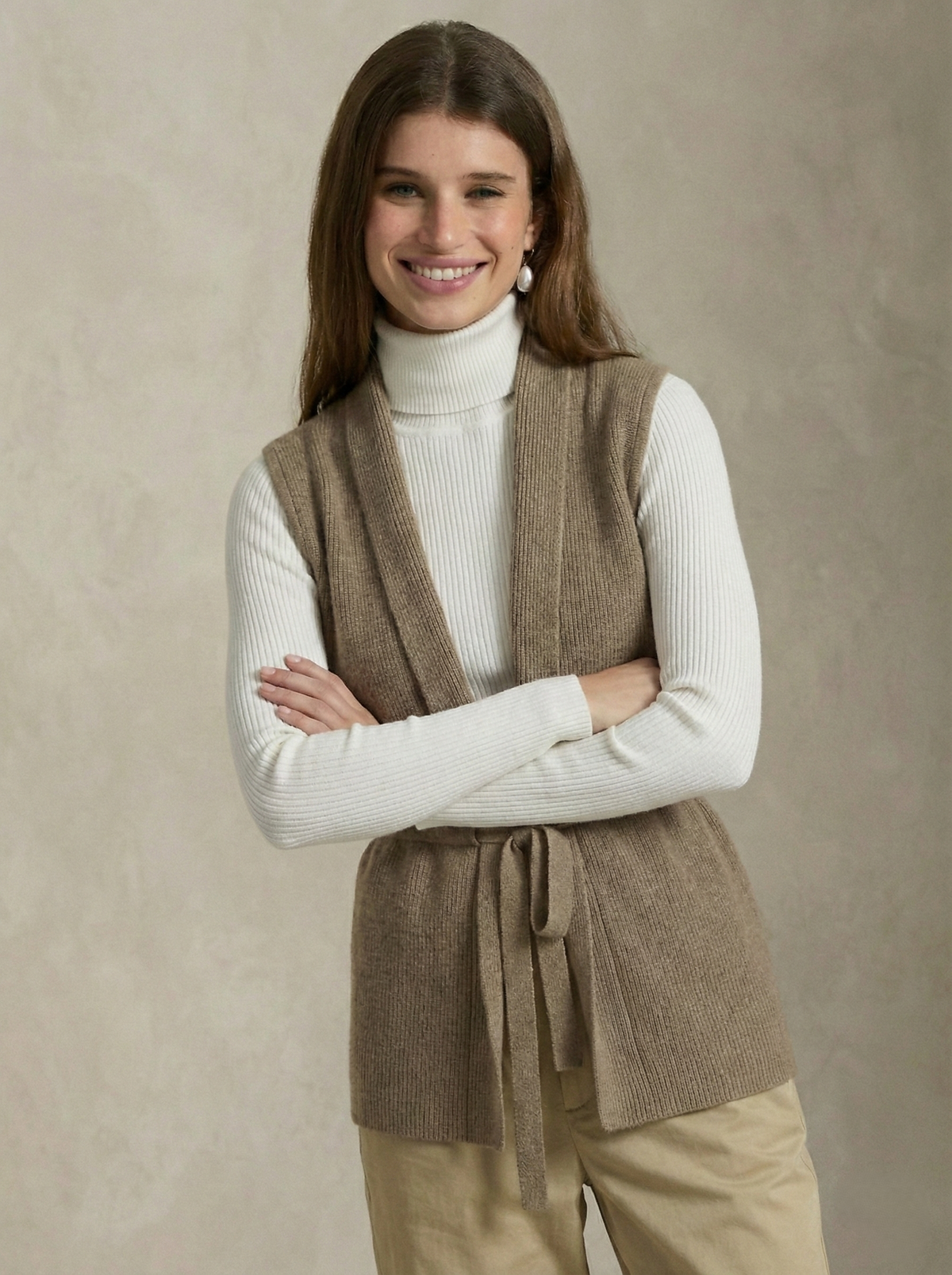 Camel merino wool belted sweater vest with V-neck and waist tie detail, sleeveless knit.
