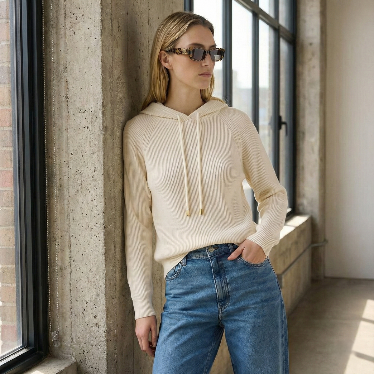 Women's knit hoodie in light beige with drawstring hood and ribbed cuffs