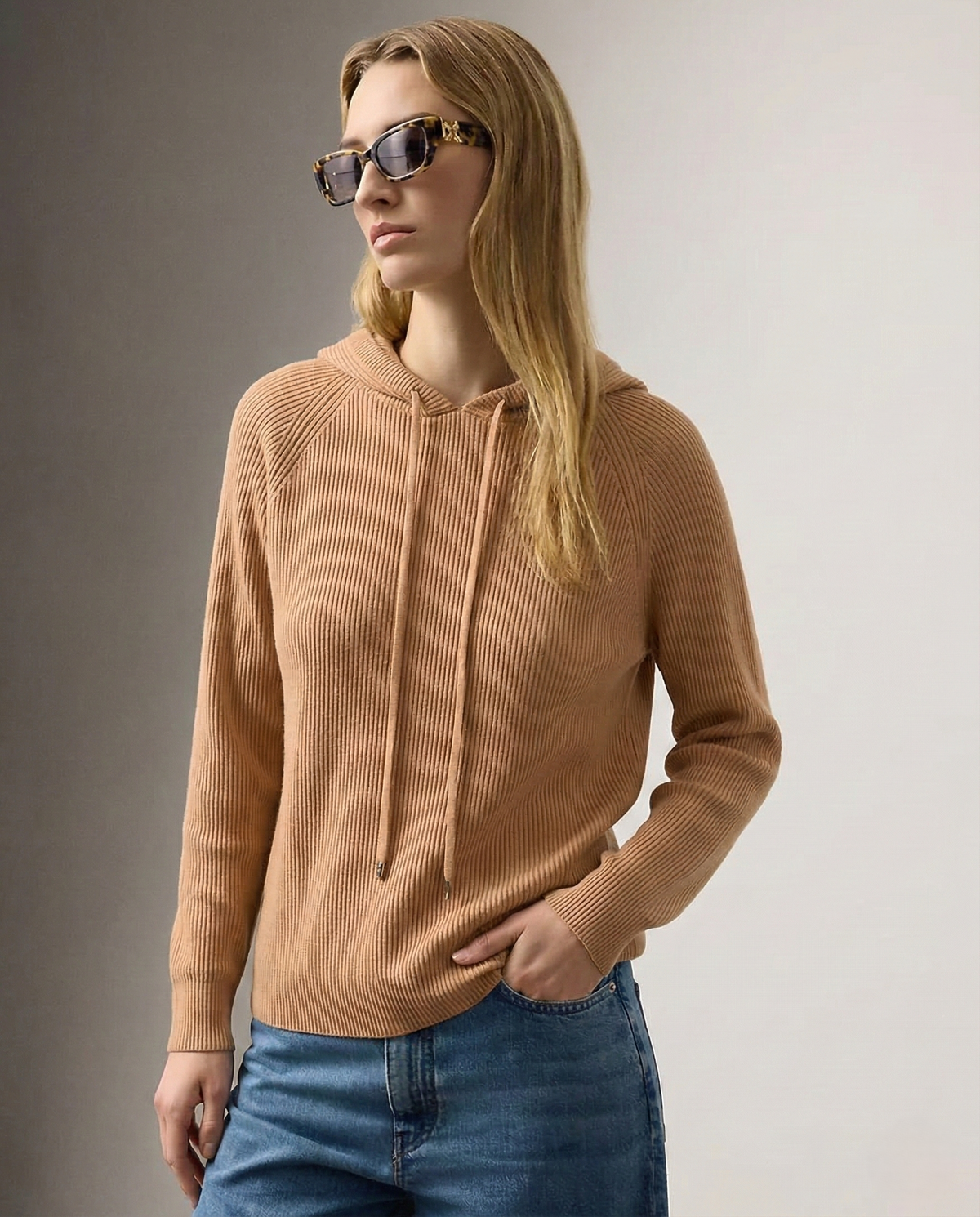 Women's knit hoodie in camel brown with drawstring hood and front pocket