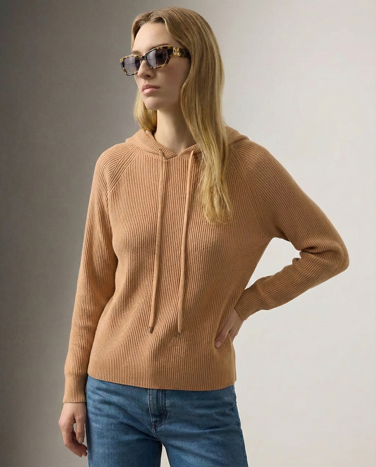 Women's knit hoodie in camel brown with drawstring hood and front pocket