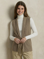 Camel merino wool belted sweater vest with V-neck, ribbed texture, and tied waist.